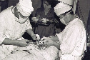 Фотография из книги А.Жантасова "Отряд Кара-майора", опубликованной по ссылке - http://desantura.ru/articles/72341/
Комментарий к фото: А.Утеев оперирует раненого